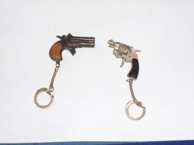 dollar store cap gun. 2 vintage cap gun key chains